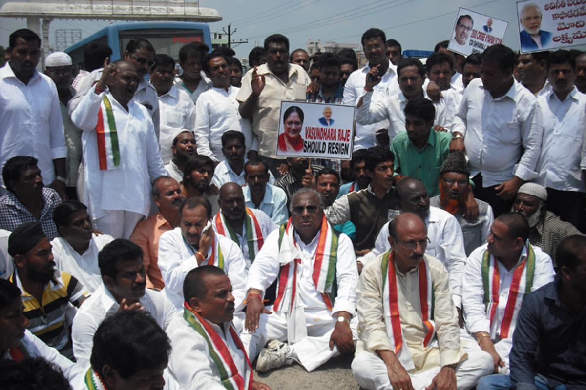 Senior Congress leader and Rajya Sabha MP V Hanumantha Rao along with Congress leaders participating in a protest dharna against the &lsquo;anti-people policies&rsquo; of the Central and the State governments, in Nizamabad on Friday. 